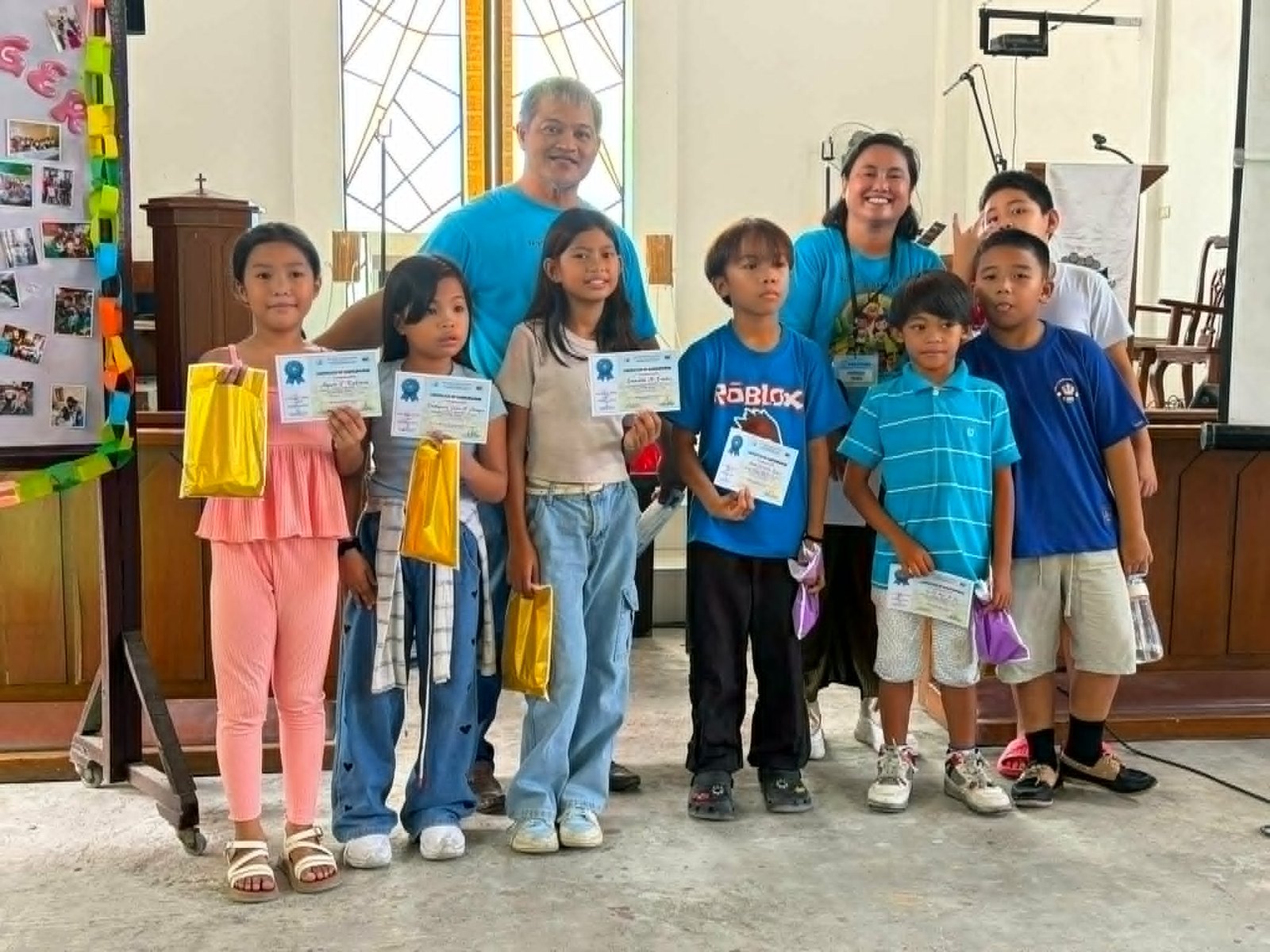 Congregation gathered for prayer and Bible distribution