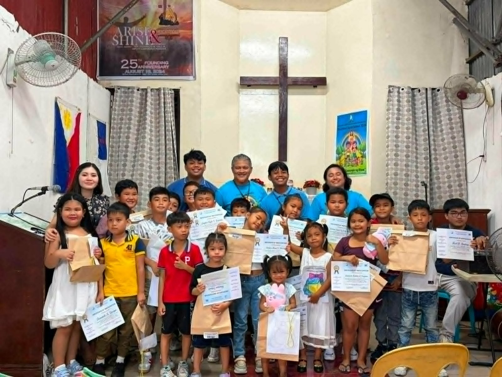 VCS Hugo Perez Outreach in Trece Martires — children with Bibles